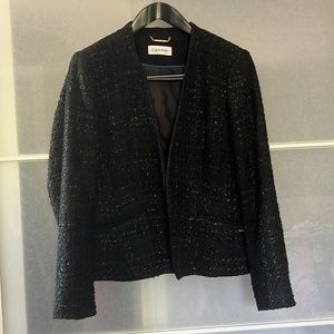 Calvin Klein blazer with angled lines to help showcase your layers.